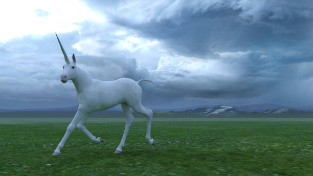 istock Unicorns in a green field 1397342713