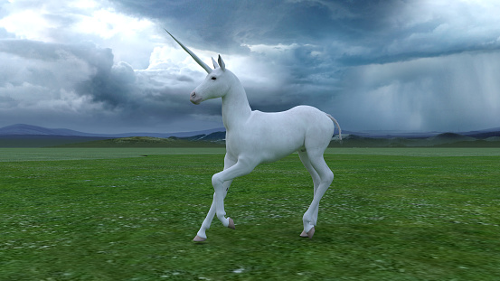 Fictional Unicorns in a green field on a stormy day