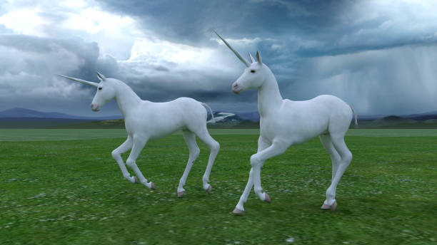 istock Unicorns in a green field 1397342720