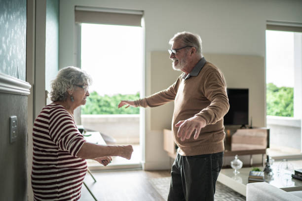 istock Senior couple dancing at home 1397342895