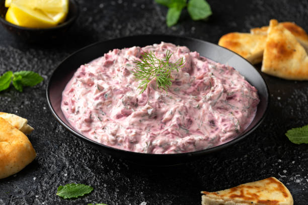 istock Greek Beetroot cucumber tzatziki dip sauce with flat bread 1397342906