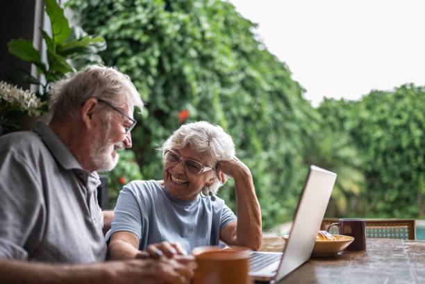 istock Happy senior couple using the laptop at home 1397343673