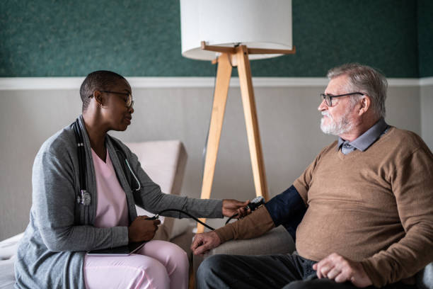 istock Nurse taking patient's blood pressure at home 1397344180