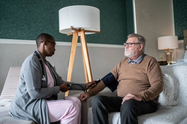istock Nurse taking patient's blood pressure at home 1397344196