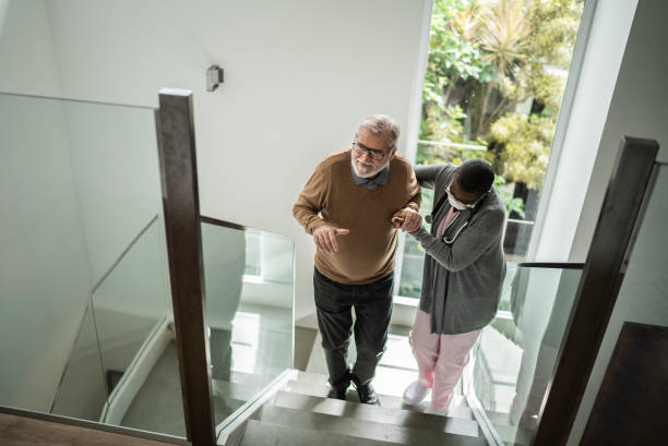 istock Nurse helping patient walking on the stairs 1397345137