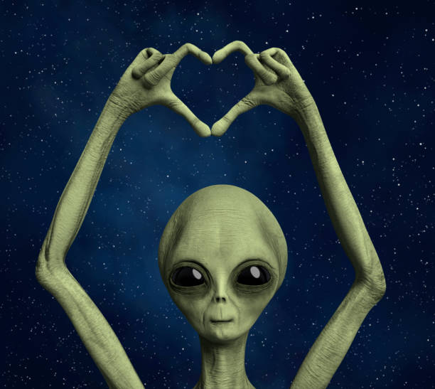 Friendly Alien making a heart hand gesture stock photo