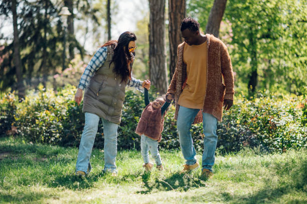 istock Multiracial family having fun in the park 1397345534