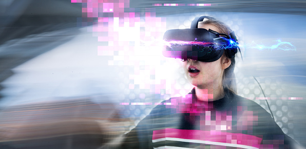 Young girl wearing VR headset, enjoying game, visual simulation.