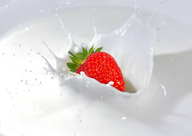 macro photo of organic yogurt with fresh sliced strawberries, food background