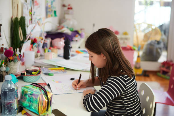 istock Little girl doing her homework 1397351026