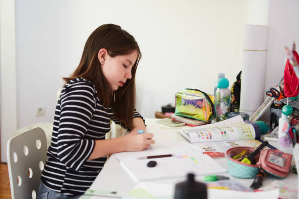 istock Little girl doing her homework 1397351040