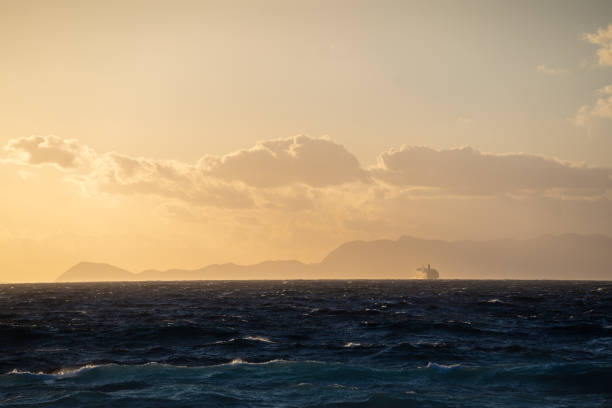 istock Sunset sky and ocean and a far away ship 1397351052