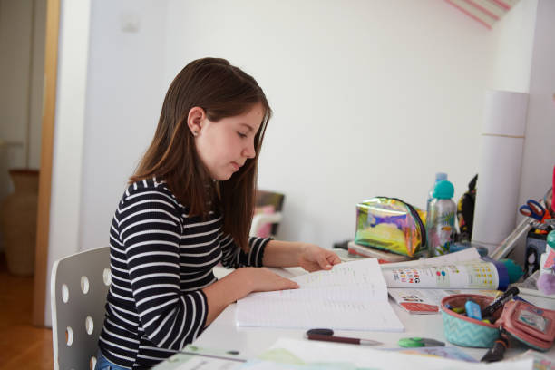 istock Little girl doing her homework 1397351085