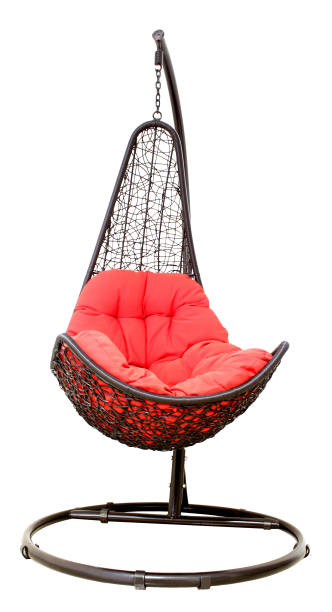 istock Wicker hanging chair swing hanging on a chain with red pillow isolated on white background 1397351977