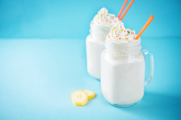 Sweet banana milkshake in a glass. toning. selective focus