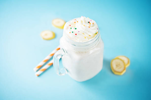 Sweet banana milkshake in a glass. toning. selective focus