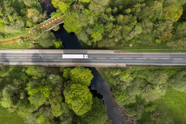 Heavy goods vehicle crossing a river using a bridge