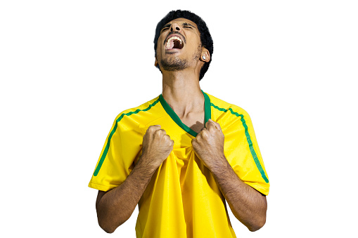 Male athlete or fan in yellow uniform celebrating isolated