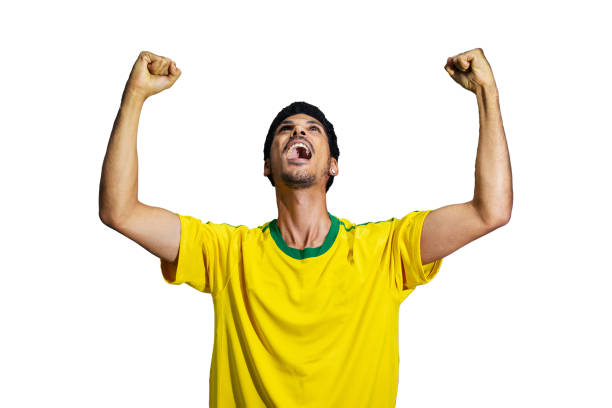 male athlete or fan in yellow uniform celebrating isolated - fan sport football male imagens e fotografias de stock