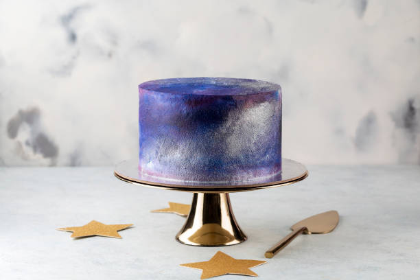 istock festive big blue cosmic cake on a light background. Sweets concept . 1397361176