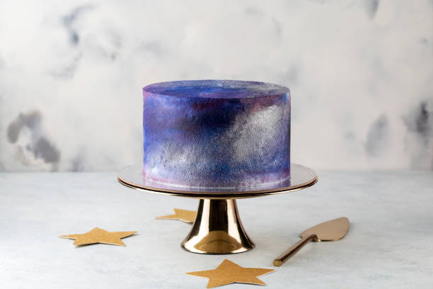 festive big blue cosmic cake on a light background. Sweets concept . stock photo