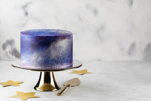 istock festive big blue cosmic cake on a light background. Sweets concept . 1397361191