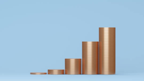 istock Stack of golden coins on blue background 1397363692