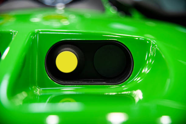 istock Close-up of yellow button. Control panel of industiral machine 1397364035