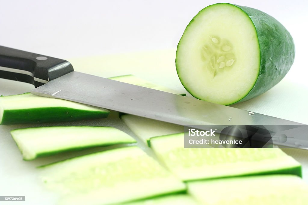 Cutting cucumber Sliced up cucumber with a kitchen knife Cold Temperature Stock Photo