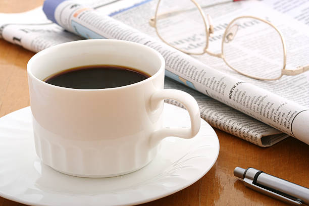 istock coffee, ballpen,glasses and newspaper 139736480