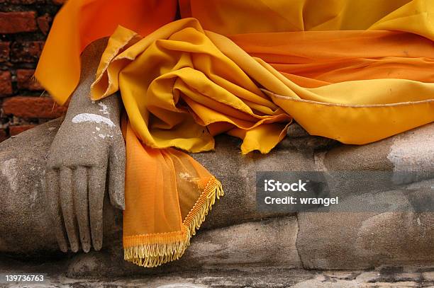 Buddha Hand Wrapped In Orange Fabric Stock Photo - Download Image Now - Buddha, Buddhism, Desire