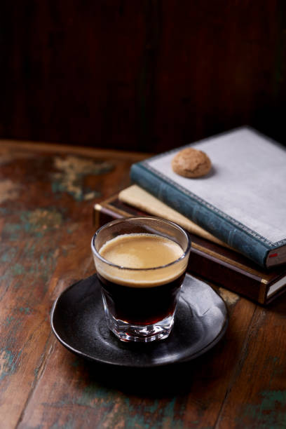 istock Coffee in glass cup on dark wooden background. Copy space. 1397368502