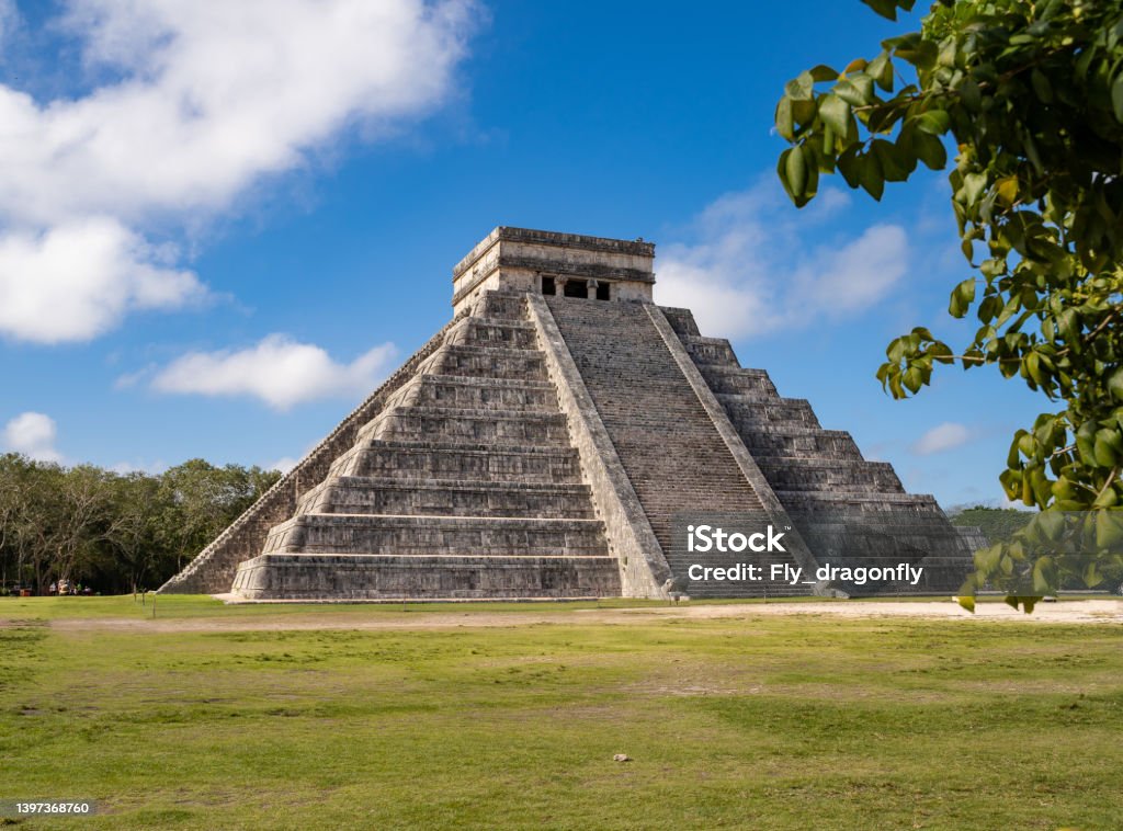 Chichen Itza Temple of Kukulcán at Yucatán, Mexico. Chichen Itza Temple of Kukulcán at Yucatán, Mexico. Sunny weather perfect blue sky. Chichen Itza was one of the largest Maya cities. popular tourist Attraction destination Ancient Stock Photo