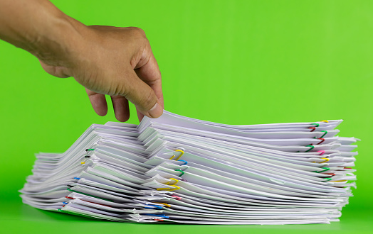 Paper Getting Up Man Hand Picking Up Paper In Stack Documents On Green Background Paper ...