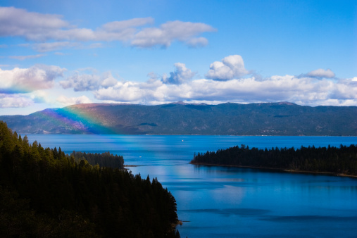 rainbow with lake tahoe with trees