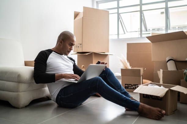 istock Young man doing an online shopping for new home 1397371314