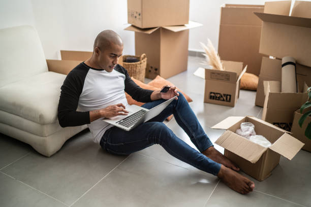 istock Young man doing an online shopping for new home 1397371316