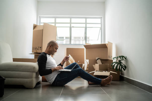 istock Young man doing an online shopping for new home 1397371317