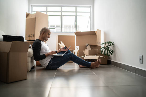istock Young man doing an online shopping for new home 1397371327