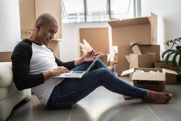 istock Young man doing an online shopping for new home 1397371349