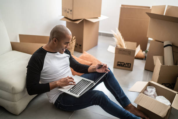 istock Young man doing an online shopping for new home 1397371387