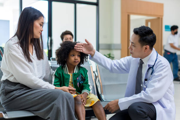 istock Asian mother and her daughter visiting doctor 1397371446