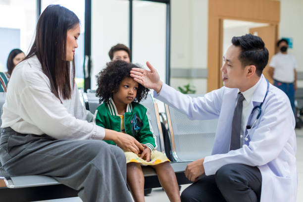 istock Asian mother and her daughter visiting doctor 1397371449