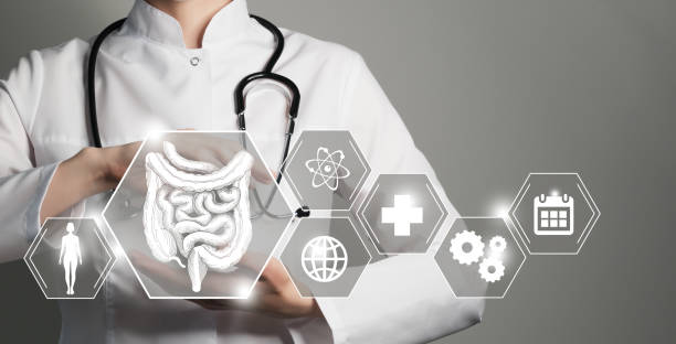 istock Unrecognizable female doctor holding graphic virtual visualization model of Intestine organ in hands. Multiple medical icons on the background. 1397372792