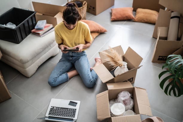 istock Young woman change home and looking for frame photo 1397373095