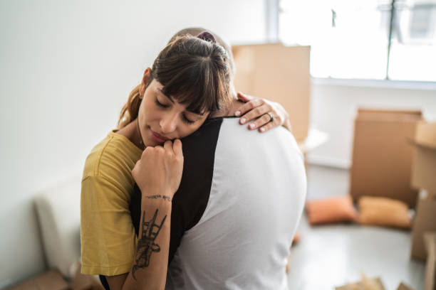 istock Couple embracing leaving home 1397373101