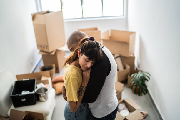 istock Couple embracing leaving home 1397373121