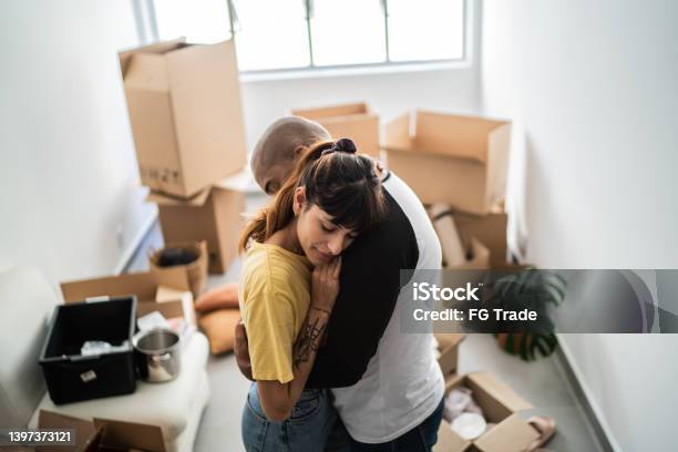 Couple Embracing Leaving Home Stock Photo - Download Image Now - Eviction, Foreclosure, Tenant