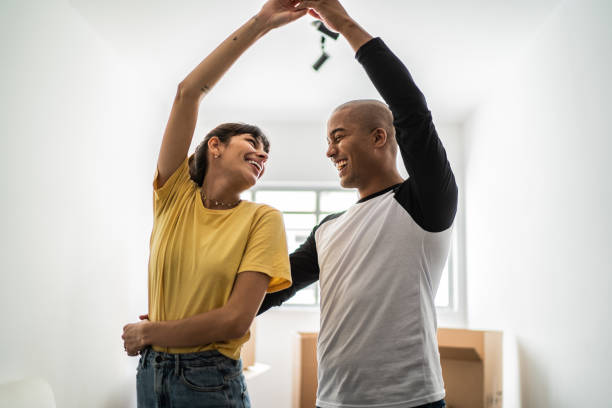 istock Happy young couple dancing when moving house 1397373299