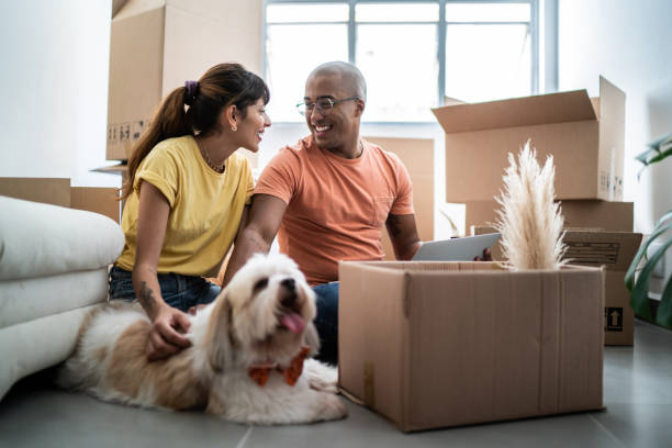 istock Young couple packing and moving boxes at home 1397373451